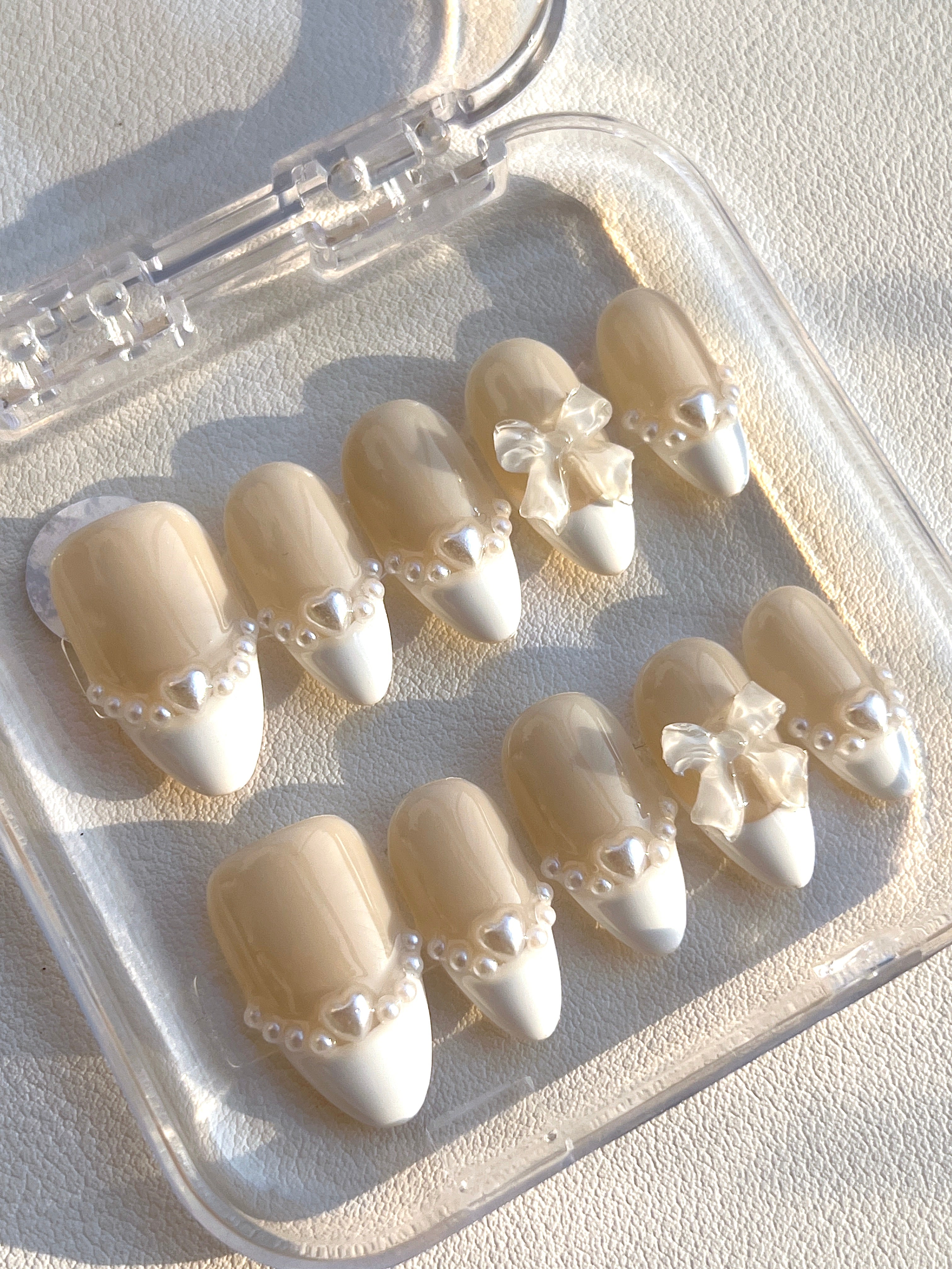 Elegant Pearl Bow Nails