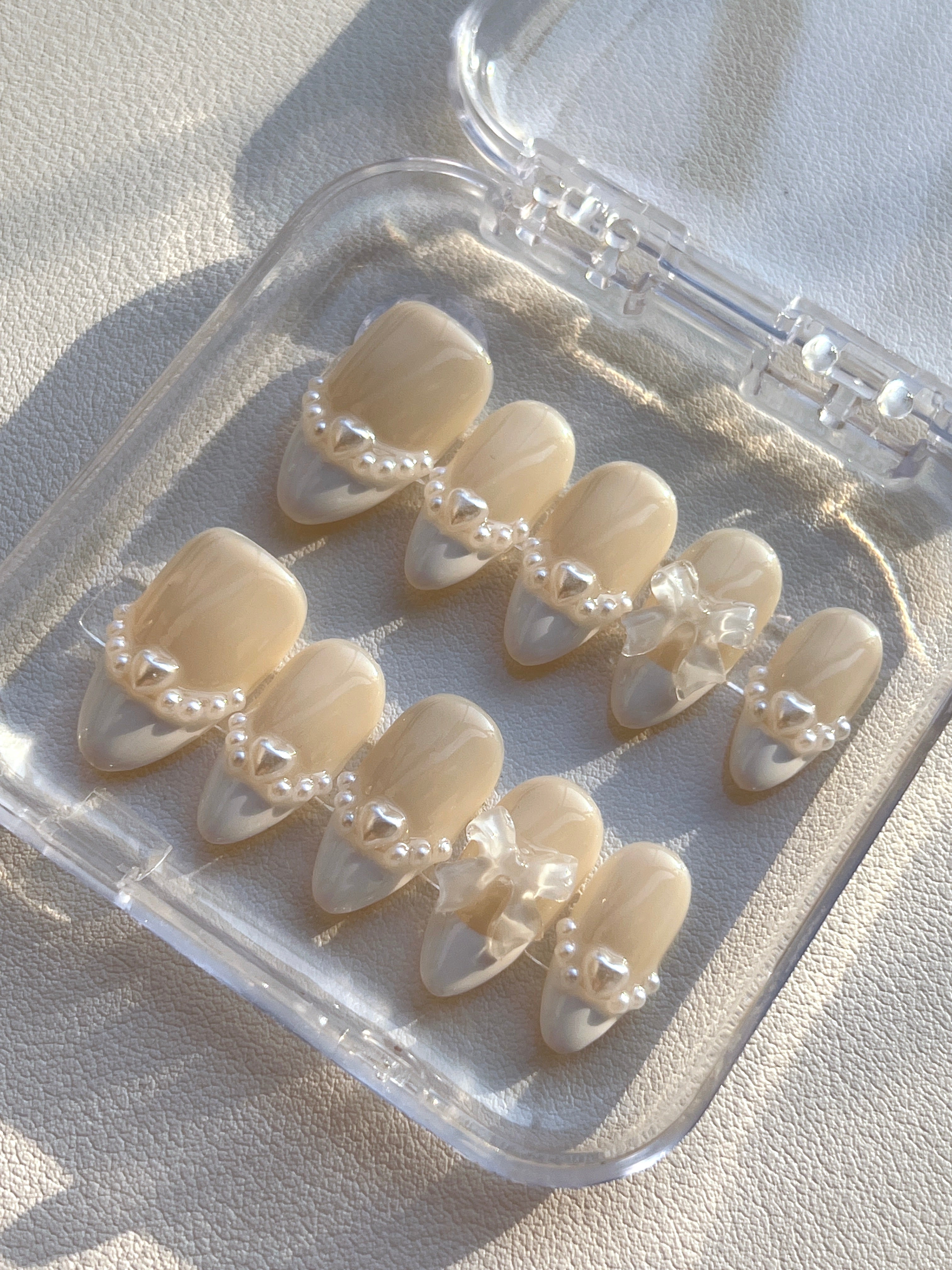 Elegant Pearl Bow Nails